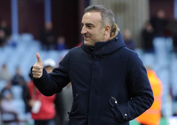 Thumbs up on the victory at Aston Villa from Carlos Carvalhal....Pic Steve Ellis