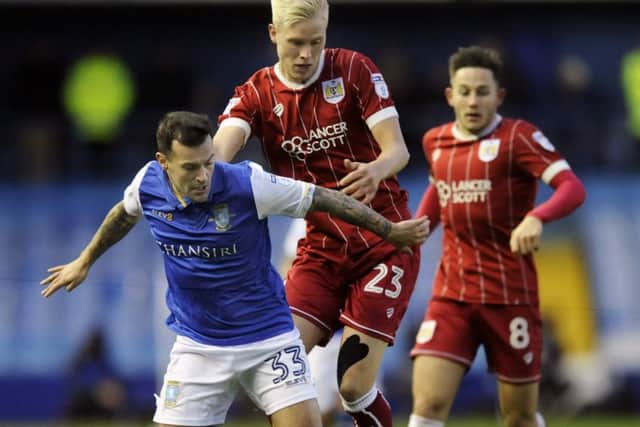 Owls Ross Wallace gets away from City's Hordur Magnusson....Pic Steve Ellis
