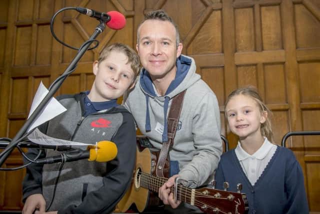 BBC Radio Sheffield's 50th birthday party at Sheffield Town Hall: The singing plumber Paul Ballington, and his children Thomas, 10, and Lana, seven - he performed live a song he wrote for the anniversary. Picture: Marisa Cashill