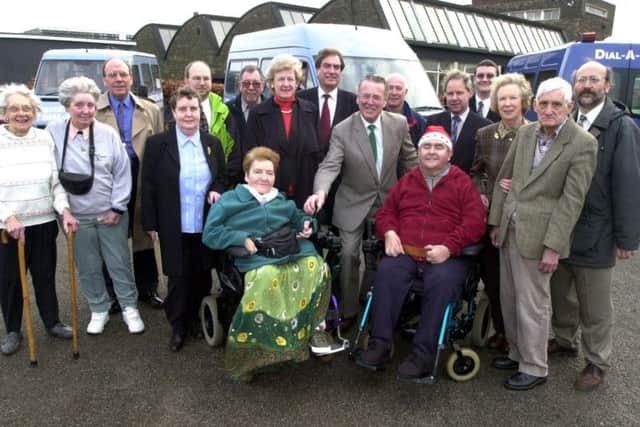 Sir Hugh Neill, centre, presents the keys to a new wheelchair accessible minibus to be used by dial-a-ride in the ceremony outside Arbourthorne and District Tenants Association on East Bank Road in 2001