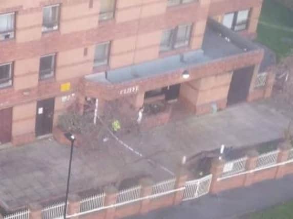 Police officers are outside a tower block in Sheffield this morning