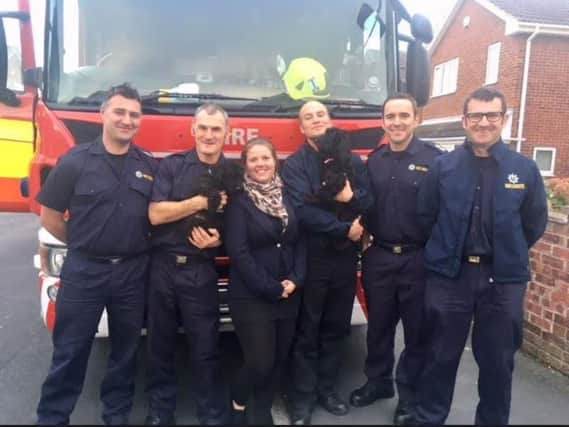 L-R: Adwick firefighters Mark Ball and Martin Walker with dog owner Shaleen Ross and firefighters Lewis Mills, John Cox and Gary Brant