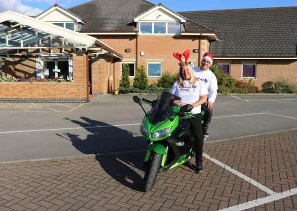 Bikers Lise Jackson & Richard Gilliver, organisers of Santas Little Bikers Motorcycle Toy Run, visit Bluebell Wood.