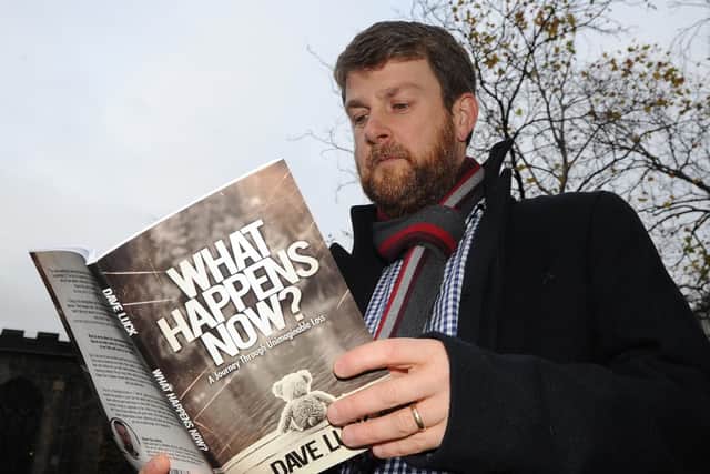 Dave Luck with his book