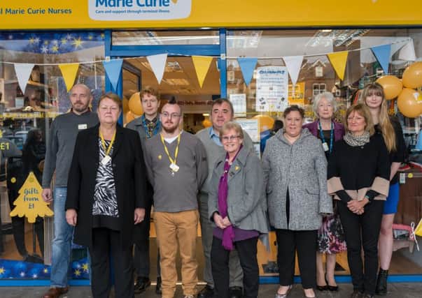 Staff and volunteers at a party to celebrate the 15th birthday of Marie Curie's Ecclesall Road shop in Sheffield.