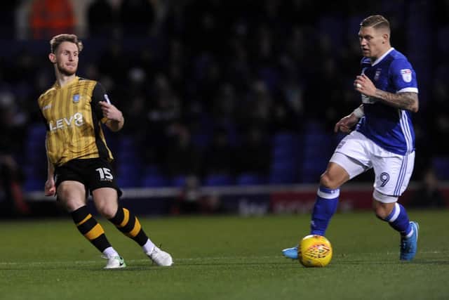 Tom Lees tries to keep up with Martyn Waghorn
