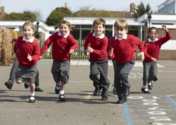A generic photo of a group of children in school uniform running through the playground. See PA Feature FAMILY Starting School. Picture credit should read: PA Photo/thinkstockphotos. WARNING: This picture must only be used to accompany PA Feature FAMILY Starting School