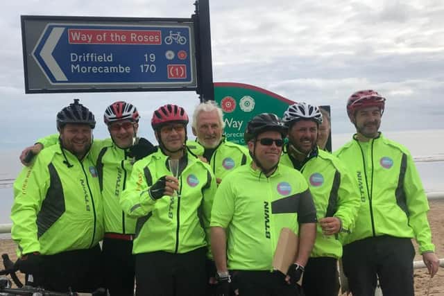 Seven South Yorkshire businessmen led by Rex Caplan, third left, complete their 170 mile bike ride from Morecambe to Bridlington which raised more than 10,000 for the ROSA Robot Appeal.