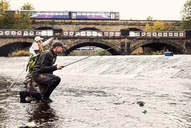 Paul and Jess fishing in the middle of Sheffield. (Photo: Tom Cockram).