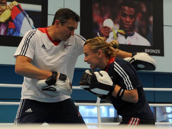 Lisa Whiteside goes through a training routine with Richie Woodhall in Sheffield