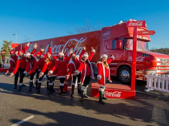Picture James Hardisty.
Coca Cola Christmas Truck at the White Rose Shopping Centre, Leeds. Pictured The Coca Cola Christmas Truck staff.