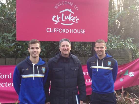 Dutch defender Joost van Aken, Owls legend John Pearson and striker Jordan Rhodes at Clifford House