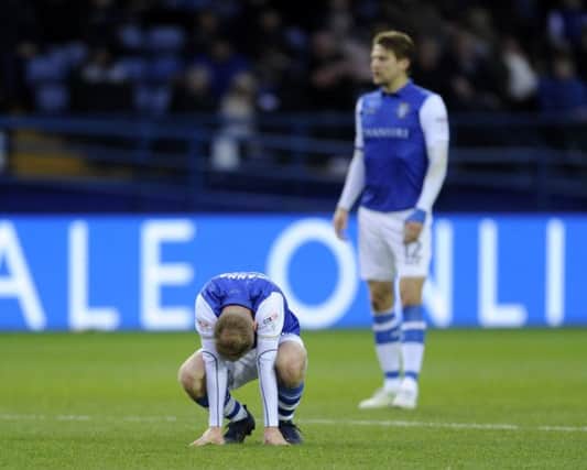 Dejection for Owls Barry Bannan with City's injury time equaliser....Pic Steve Ellis