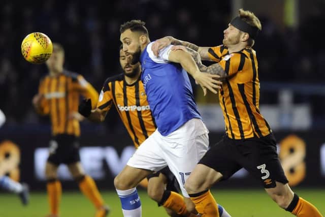 Owls Atdhe Nuhiu holds off Citys Ondrej Mazuch.....Pic Steve Ellis