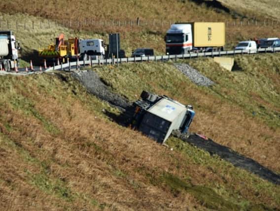 The lorry overturned after skidding off the road. Photos by Gary Sharples