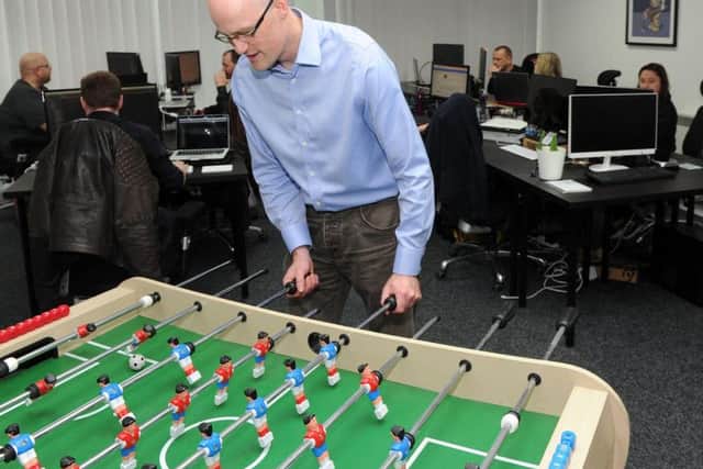 Neil Armstrong plays table football at TribePad.