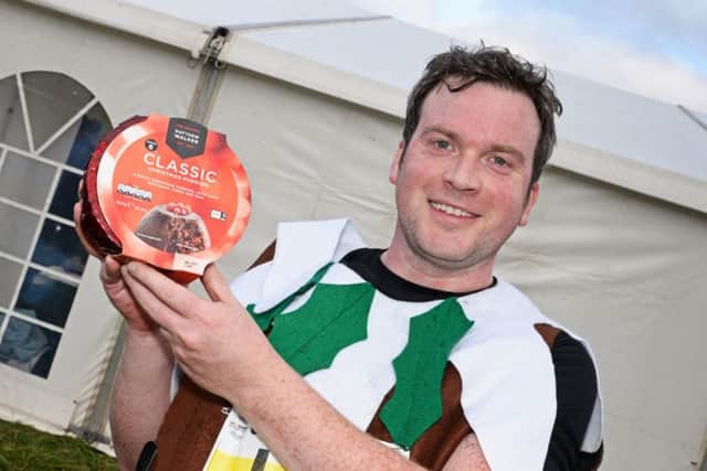 Tom Russell, of Sheffield, pictured with his Christmas Pudding after taking part in the Percy Pud race.  Picture: Marie Caley