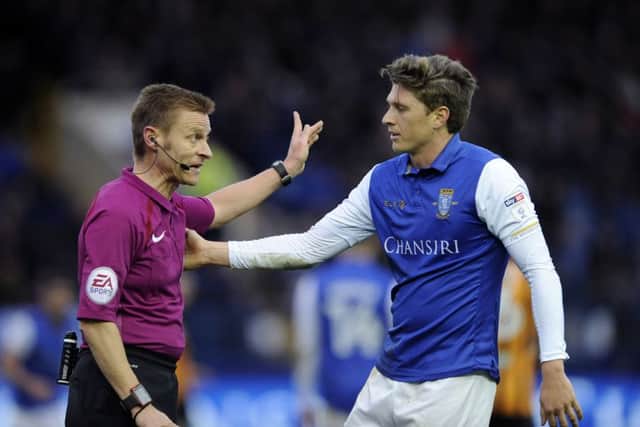 Referee Mike Jones with Owls Adam Reach.....Pic Steve Ellis