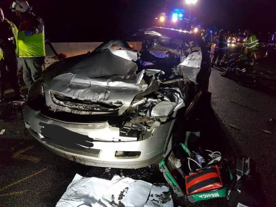 The wreckage of a Vauxhall Vectra involved in a crash on the M1