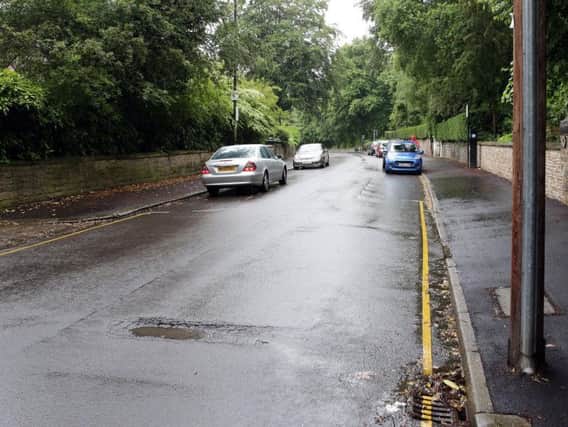 Potholes appeared on Collegiate Crescent, Broomhall, last year after it had been resurfaced. Picture: Glenn Ashley
