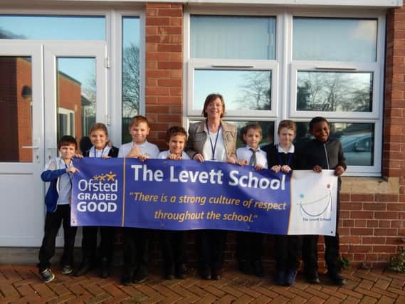 Headteacher Karen Green and children from Levett School