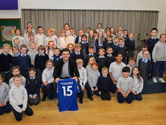 The England star with year three and four pupils. Picture: Marie Caley/The Star