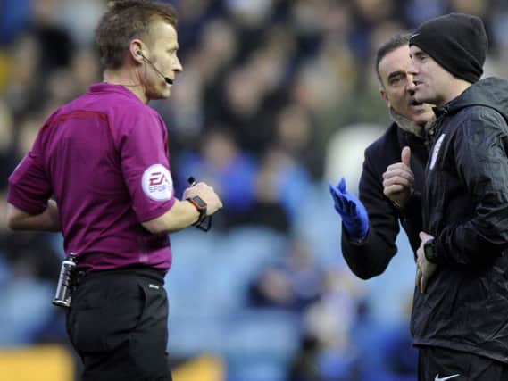 Carlos Carvalhal is given a taking to by the referee Mike Jones during the match against Hull City in which he would eventually be sent off