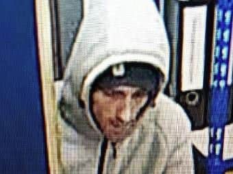CCTV of a man wanted in connection with a theft.