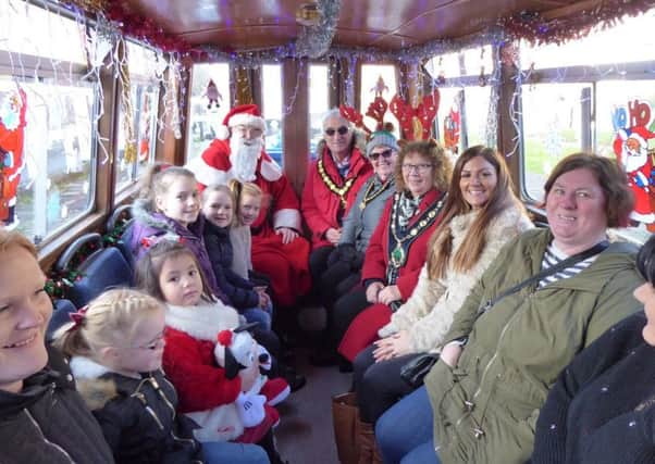 Cruising alon the Chesterfield Canal with Santa are (from left) Coun Madelaine Richardson (Chair BDC), Mrs Margaret Handley, Coun John Handley (Chair NCC) and Santa