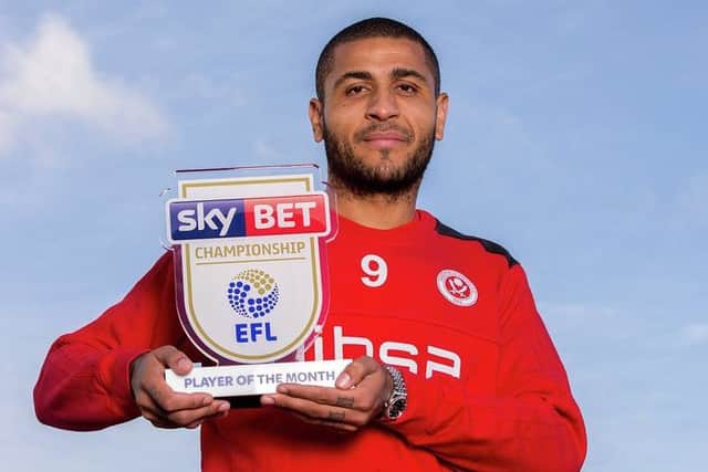 Leon Clarke with his Sky Bet Championship Player of the Month award: Robbie Stephenson/JMP