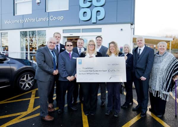 The charity Roundabout received a cheque for Â£6374.26 from the Co-Op membership scheme, Local Community Fund on Saturday at the White Lane store in Sheffield.
Pictured at the presentation are from the left, Rhys Doble, Co-Op area manager, John Gregg, Newfield Green, Simon Rowlinson,Birley Moor store, Nigel Ogley, Senior Funeral Director, Suffolk Road, Louise Singh, White Lane store manager, Greg Hutchinson, support centre Manchester, Charlotte Speight from the Roundabout charity,  Tracey Wilson, Funeral Care Abbey Lane, Michael Finch, Northern Avenue store manager and Jean Smith Co-Op Community Pioneer.