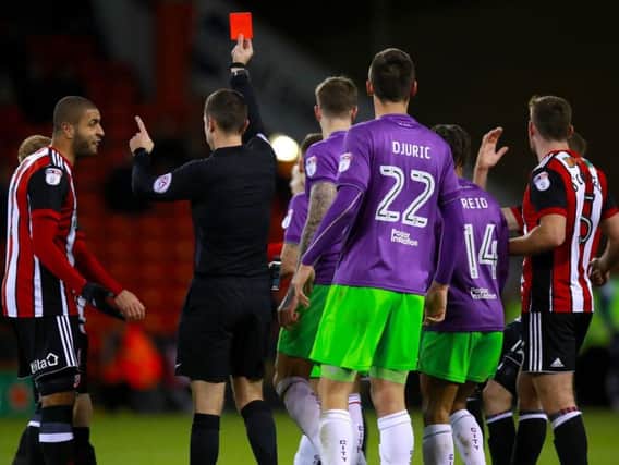 John Fleck (not in picture) receives his marching orders
