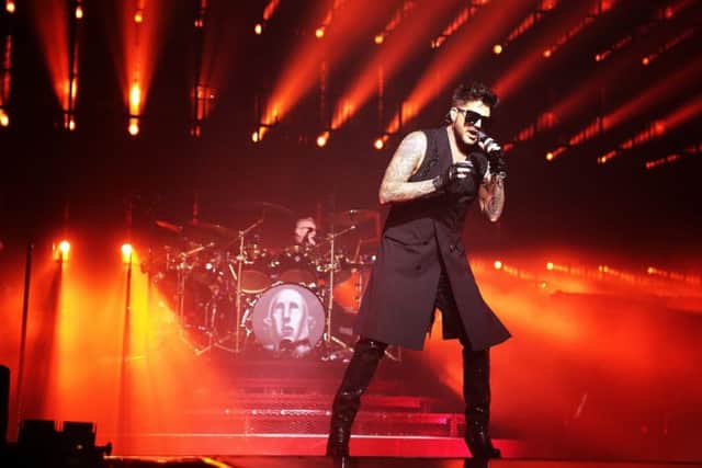 Adam Lambert with Queen drummer Roger Taylor behind. Picture: Glenn Ashley.