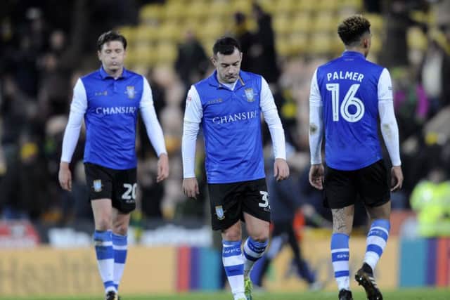 Dejected Owls trio...Adam Reach,Ross Wallace,and Liam Palmer after a 3-1 defeat at Carrow Road....Pic Steve Ellis