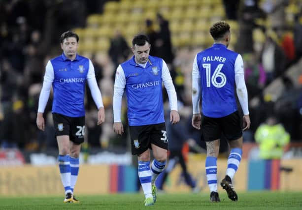 Dejected Owls trio...Adam Reach,Ross Wallace,and Liam Palmer after a 3-1 defeat at Carrow Road....Pic Steve Ellis
