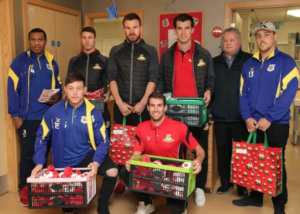 Doncaster Rovers Football Club and Doncaster Rugby League players and staff with gifts
