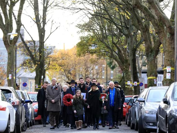 A Remembrance Day procession on Western Road, Crookes, where 23 war memorial trees are due to be replaced