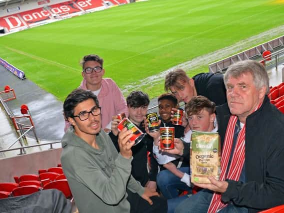 Martin O'Hara, Deputy Chair of football supporters federation (FSF), pictured with students from Club Doncaster sports and education foundation, Vaz Lindley, Alex Colliver, Oliver Bristow, Ricardo Kowo, Jack Beardshaw and Charlie Hellewell, who are also supporting the campaign. Picture: Marie Caley NDFP Rovers Foodbank MC 3
