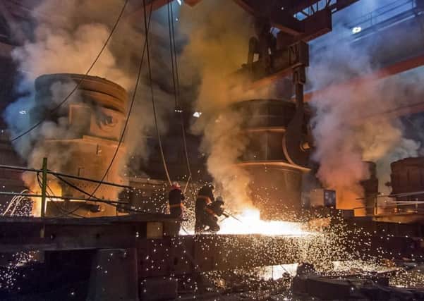 Huge ladles of 90 tonnes of molten steel in meltshop at Forgemasters.