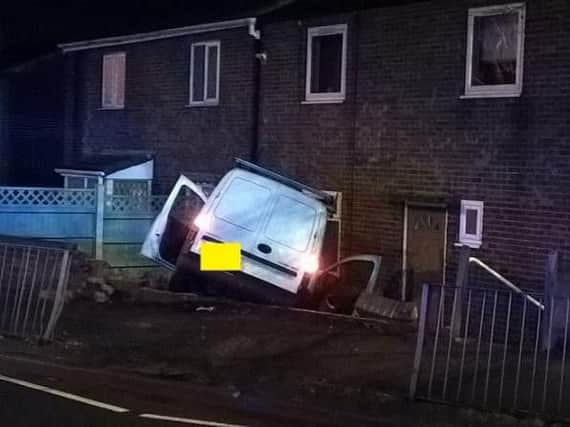 A van ended up in a garden after the driver lost control in Rawmarsh