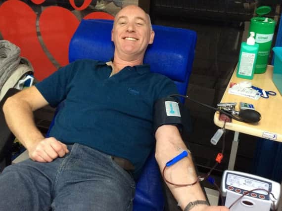 Steve Cook has given his 100th blood donation