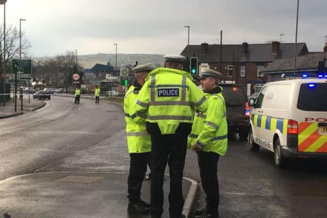 Police officers at the scene of a collision in Halifax Road this morning (Pic: BBC Radio Sheffield)