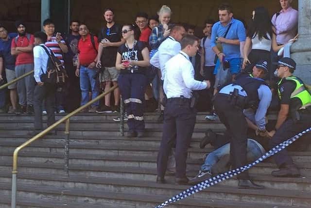 Pedestrians were injured in Melbourne after a car ploughed into a crowd outside a train station