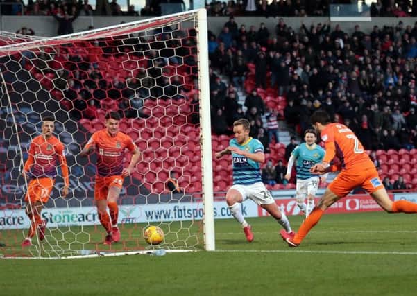 James Coppinger turns in from close range to put Rovers ahead against Northampton