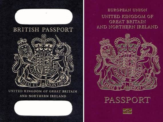 Old British passport (left) and a burgundy UK passport in the European Union style format. PA Wire