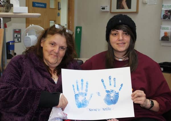 Arts Council England, together with the Sheffield Hospitals Charity, has funded the Palliative Care Centre project, which encourages patients, their relatives, visitors and staff to take part in simple but meaningful creative activities. Pictured are Patient Norma Drabble and her daughter Natalie, who have made a mini collage and had their hands printed.