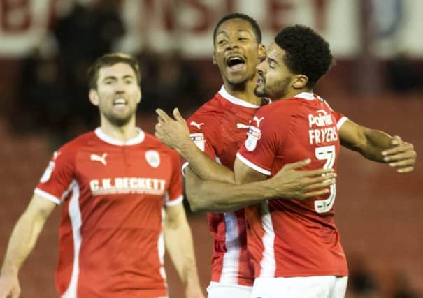 Barnsley's Ethan Pinnock celebrates after equalising in the last minute. Photo: Dean Atkins