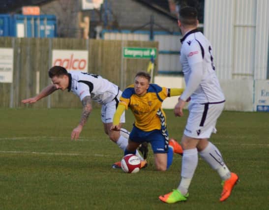 Brodie Litchfield is brought down as Stocksbridge attack. Photo: Gillian Handisides