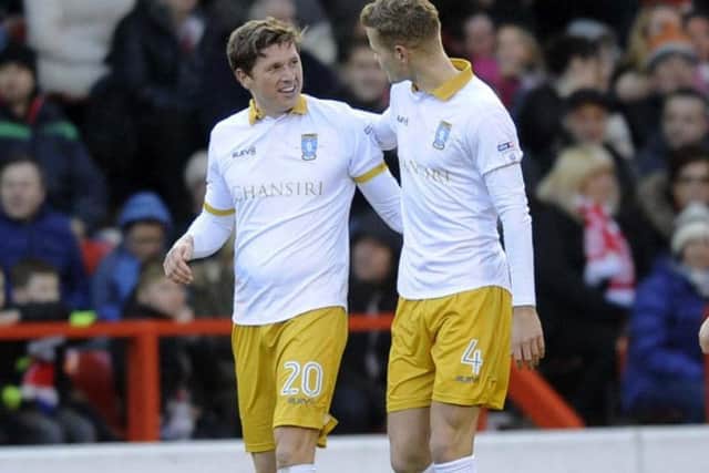 Adam Reach (left) opened the scoring for Wednesday in their 3-0 win at Nottingham Forest