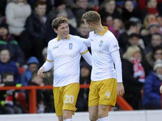 Adam Reach (left) opened the scoring for Wednesday in their 3-0 win at Nottingham Forest